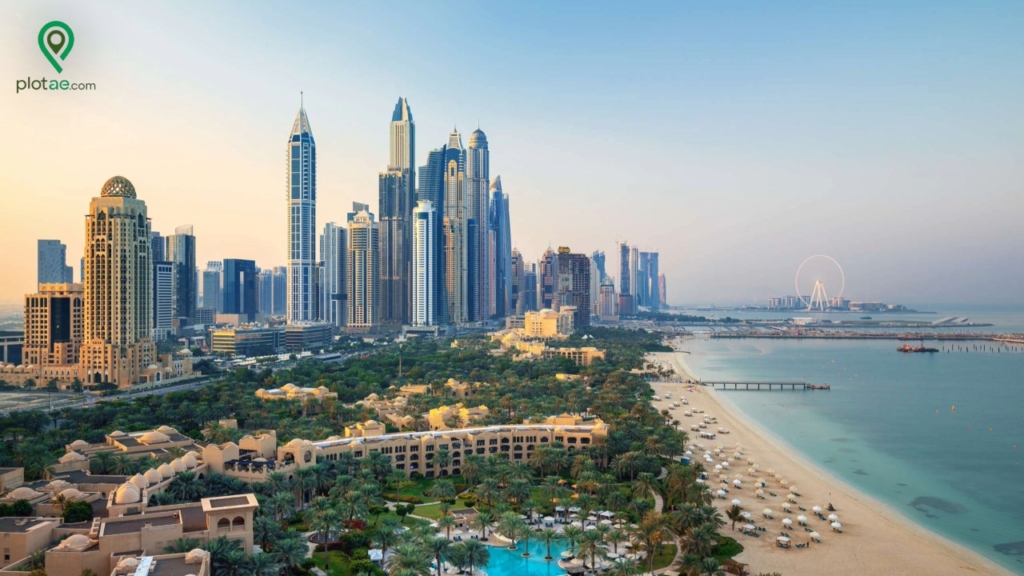 Aerial view of Jumeirah area with luxury beachfront, modern skyscrapers, and lush gardens in Dubai, showcasing Jumeirah Garden plots for sale near the coast.